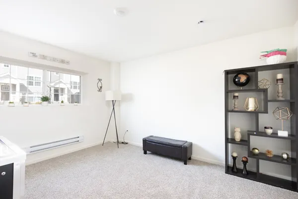 a room with furniture and white walls