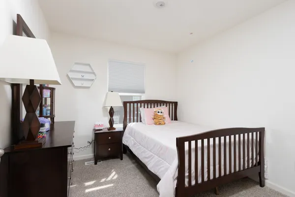 a bedroom with a bed and a walk in closet