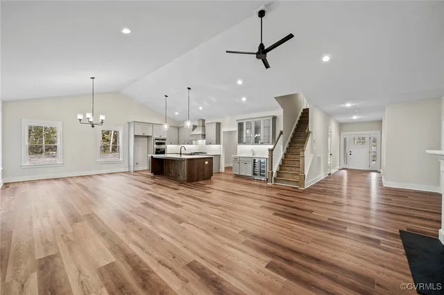 a view of a room with kitchen and stainless steel appliances