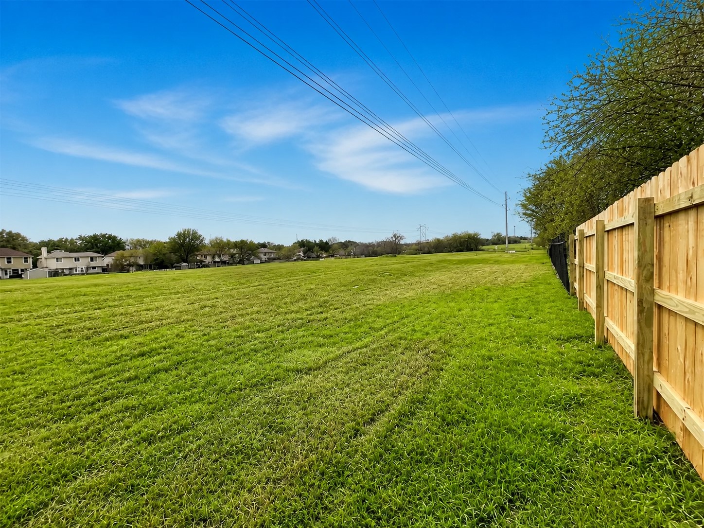 14828 Single Trace Austin, TX 78728 - Photo 28 of 30 Expansive green field with a new wood privacy fence
