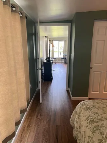 a view of entryway with wooden floor