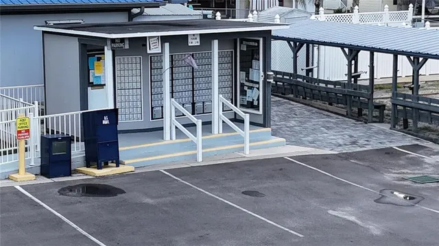 a view of a house with backyard and porch