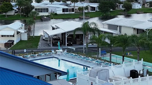 a view of house with outdoor space swimming pool and outdoor seating