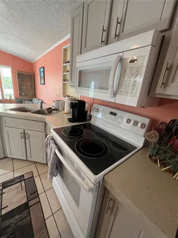 a kitchen with a stove and a sink