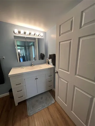a bathroom with a double vanity sink and mirror