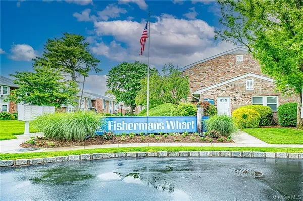 a view of a house with a yard and plants