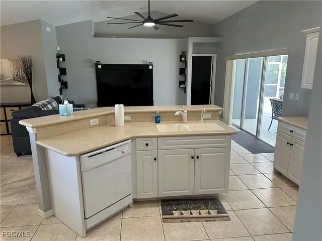 a view kitchen with a sink and a stove top oven