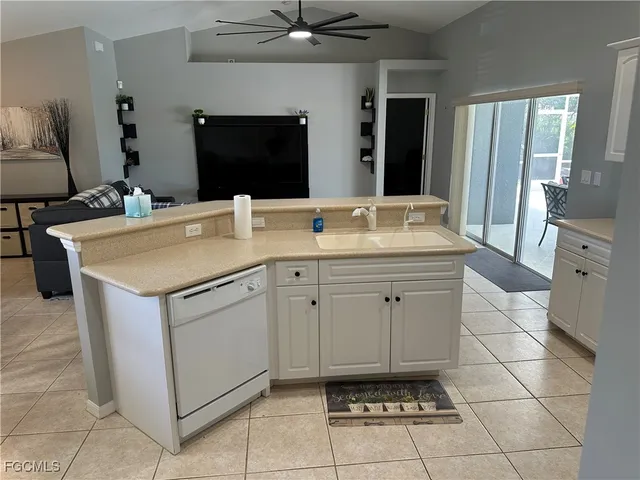 a spacious bathroom with a sink and a mirror