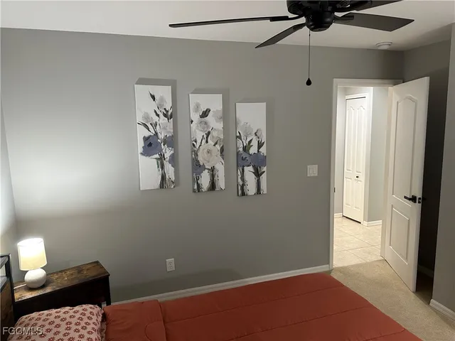 a view of a livingroom with furniture and a ceiling fan