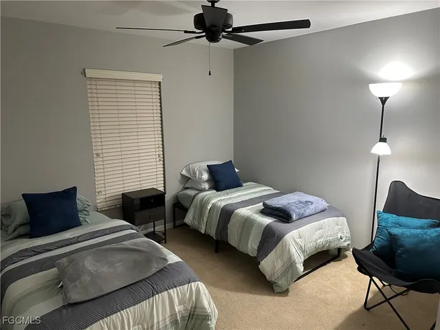 a bathroom with a sink a toilet a vanity and mirror
