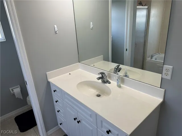 a white toilet sitting next to a window