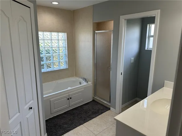 a bathroom with a toilet a sink and shower