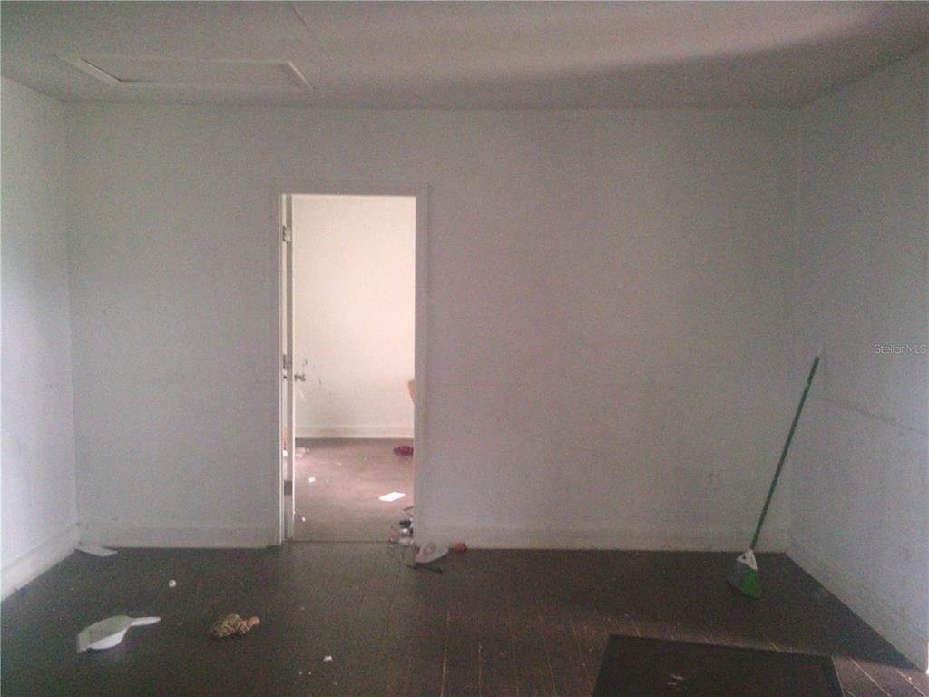 11951 Wichers Road San Antonio, FL 33576 - Photo 26 of 41 an empty room with wooden floor