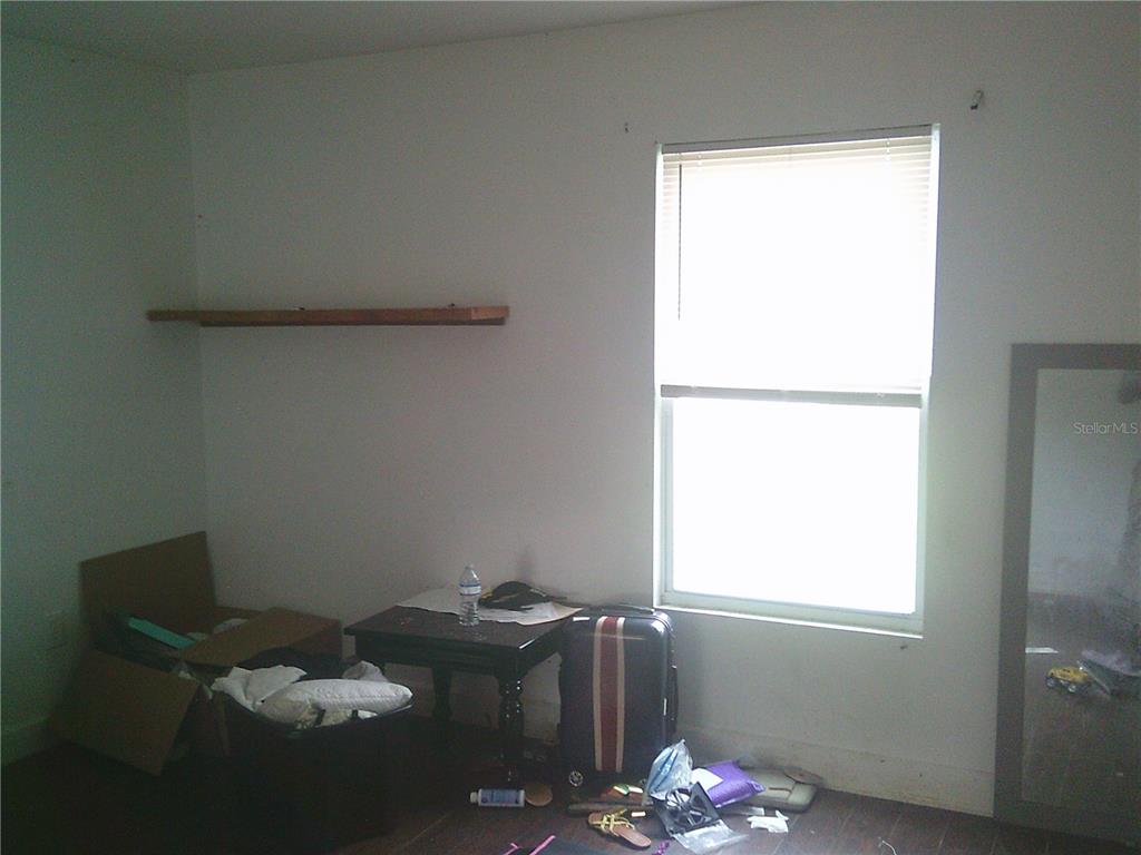 11951 Wichers Road San Antonio, FL 33576 - Photo 28 of 41 a living room with furniture and a window