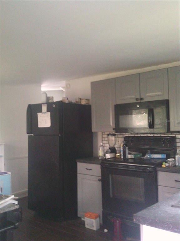 11951 Wichers Road San Antonio, FL 33576 - Photo 35 of 41 a kitchen with a sink and refrigerator