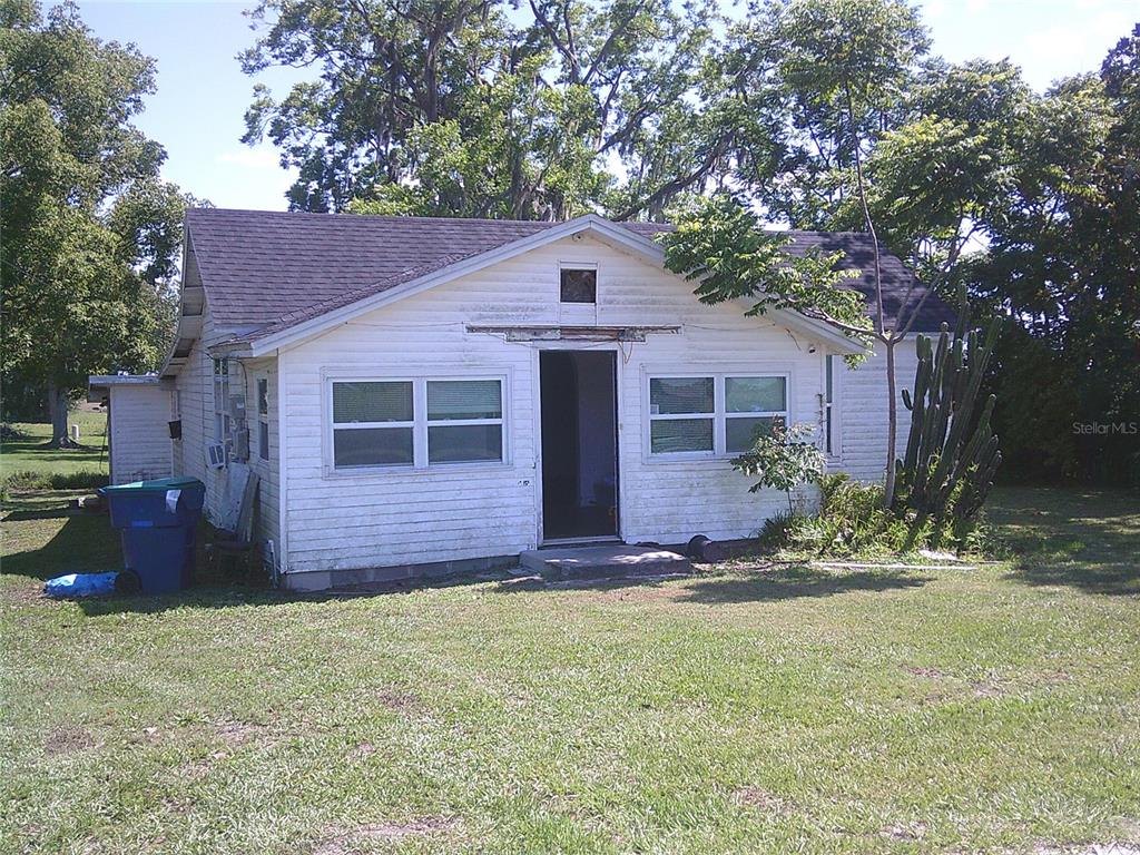 11951 Wichers Road San Antonio, FL 33576 - Photo 6 of 41 a front view of a house with a yard