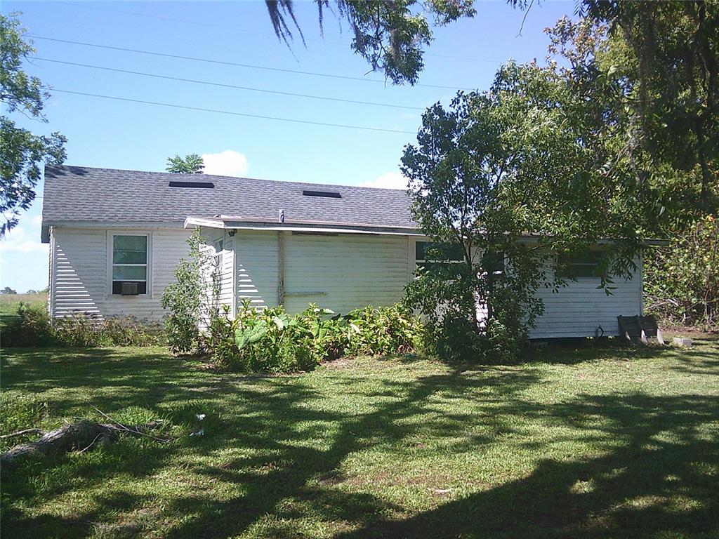 11951 Wichers Road San Antonio, FL 33576 - Photo 9 of 41 a front view of a house with garden