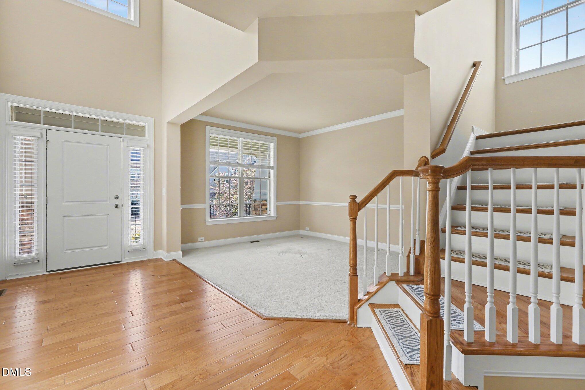 351 Gartrell Way Cary, NC 27519 - Photo 6 of 51 a view of entryway with wooden floor and stairs
