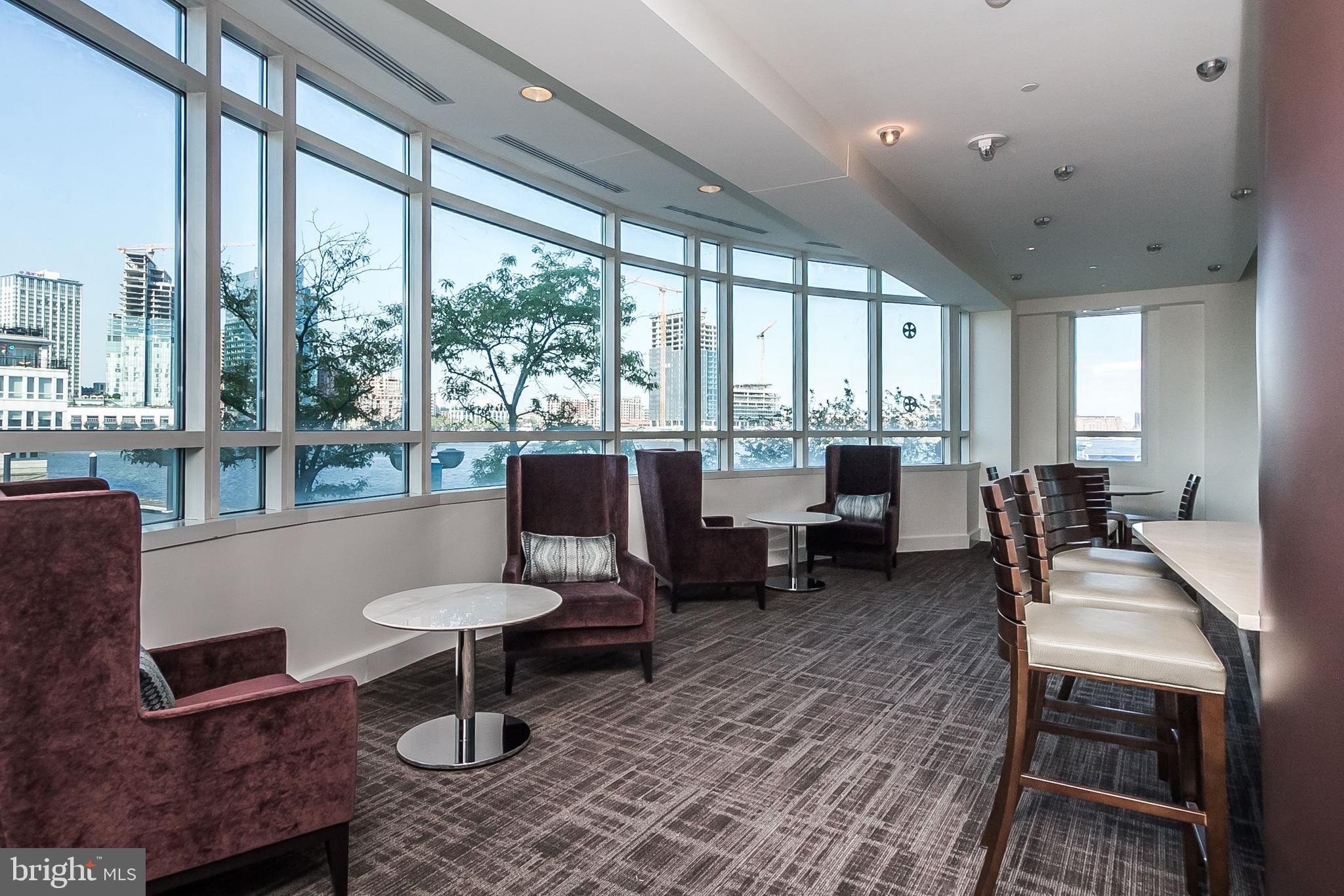 100 Harborview Drive, Unit 513 Baltimore, MD 21230 - Photo 42 of 58 a living room with furniture and a large window