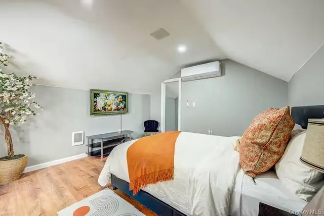 a bedroom with a bed and a desk