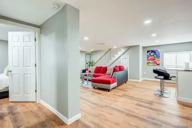 a bedroom with furniture and a window