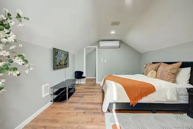 a living room with a bed and a couch