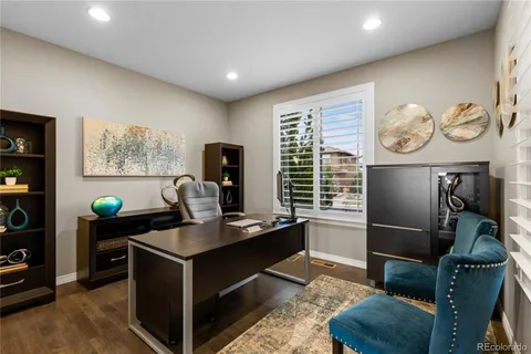 a spacious bedroom with a bed and a couch