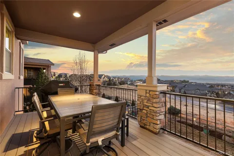 a view of a balcony with furniture