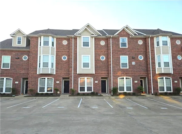 a front view of a building with a street
