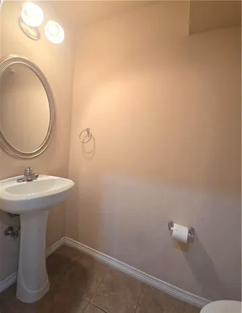 a bathroom with a sink and mirror