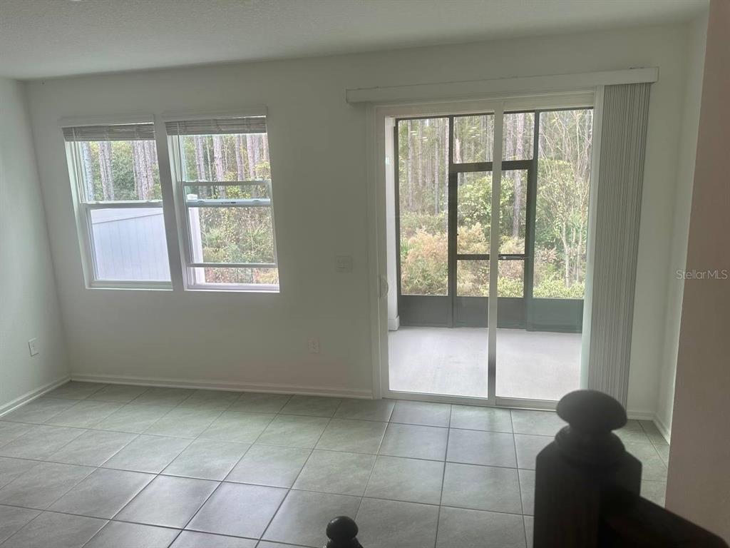 455 Redbud Road Palm Coast, FL 32137 - Photo 8 of 12 a view of an empty room with a window