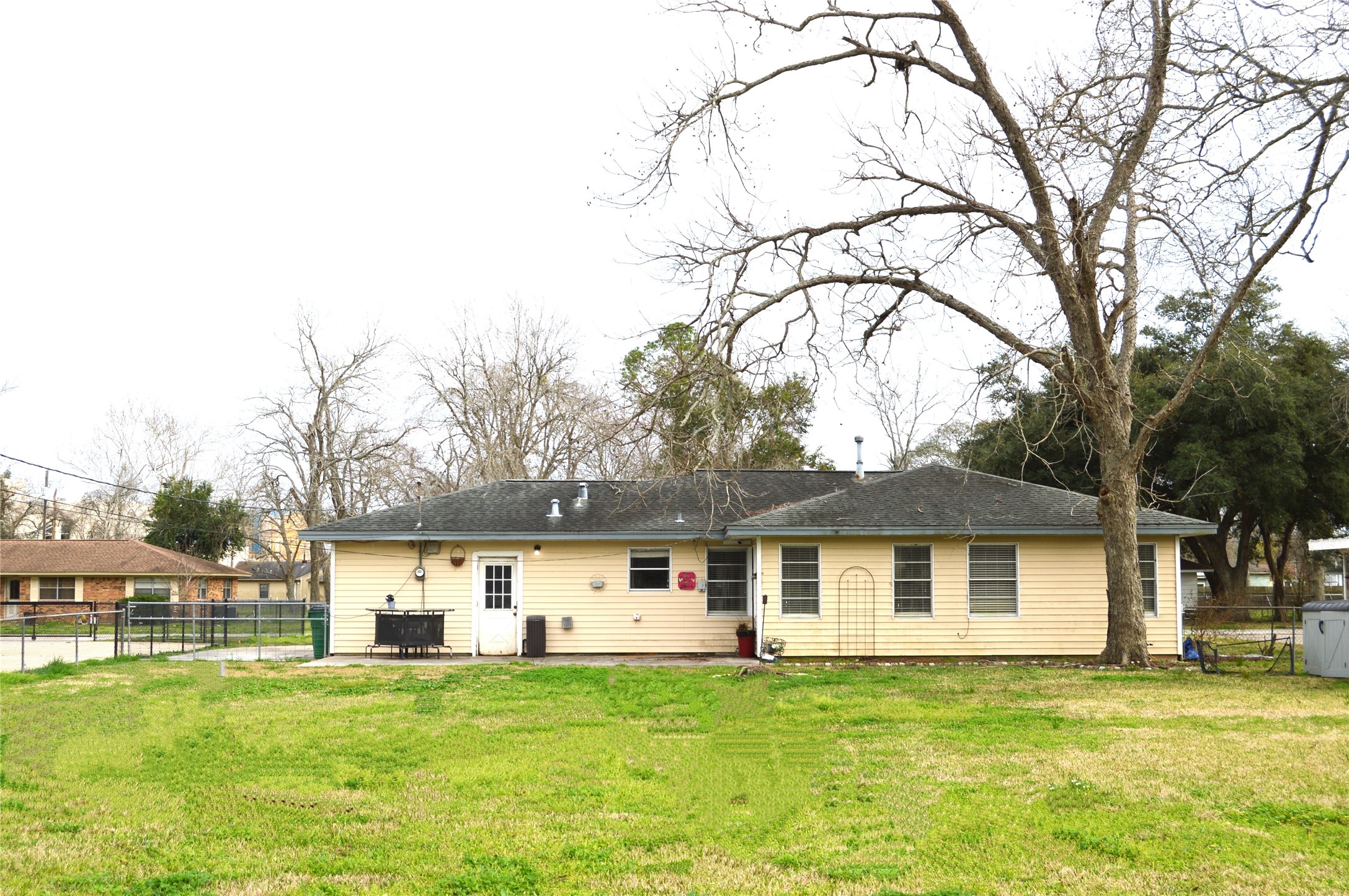 a front view of a house with a garden and yard