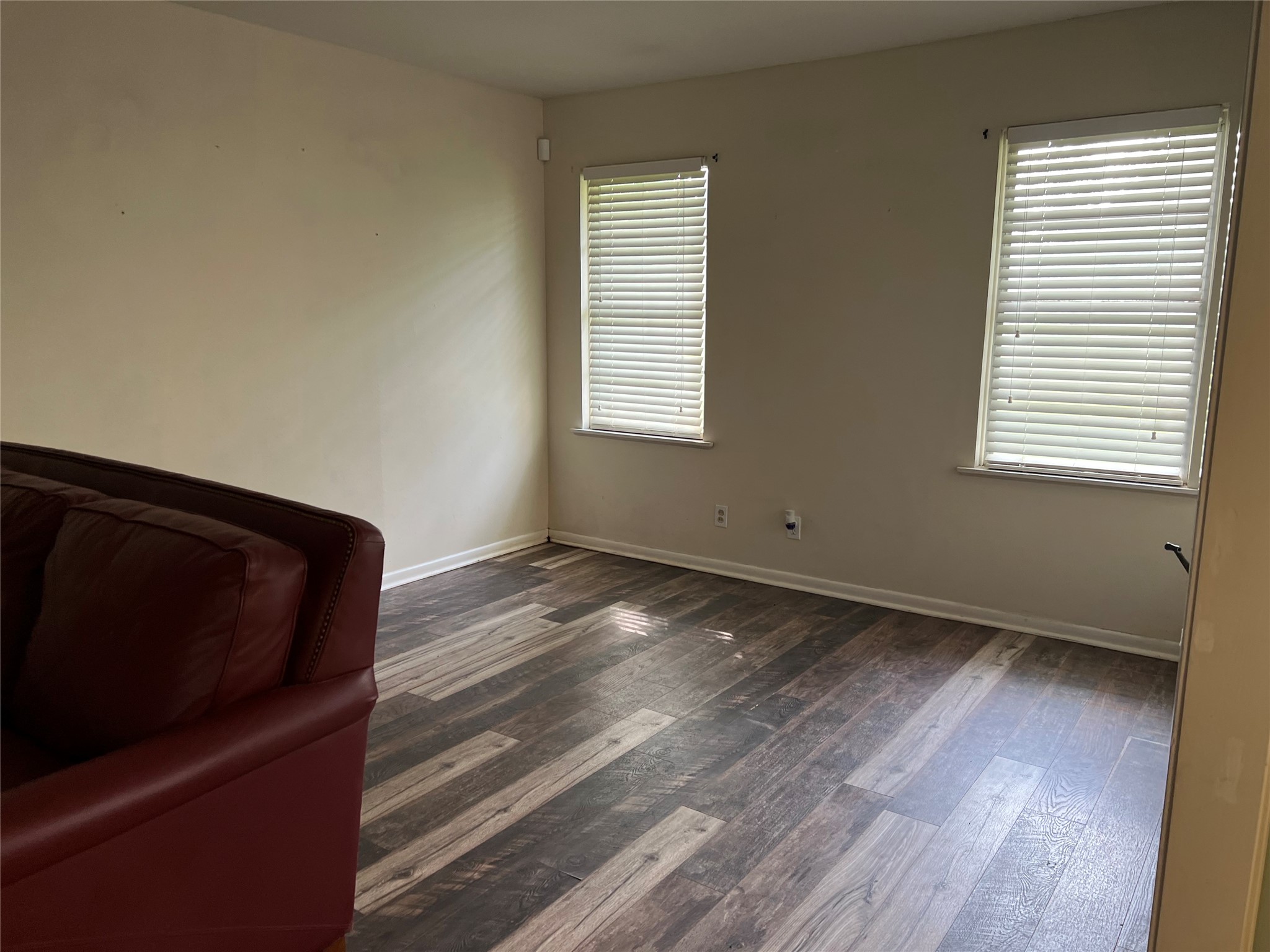 1105 Earley Street Sweeny, TX 77480 - Photo 5 of 12 a view of an empty room with wooden floor and a window