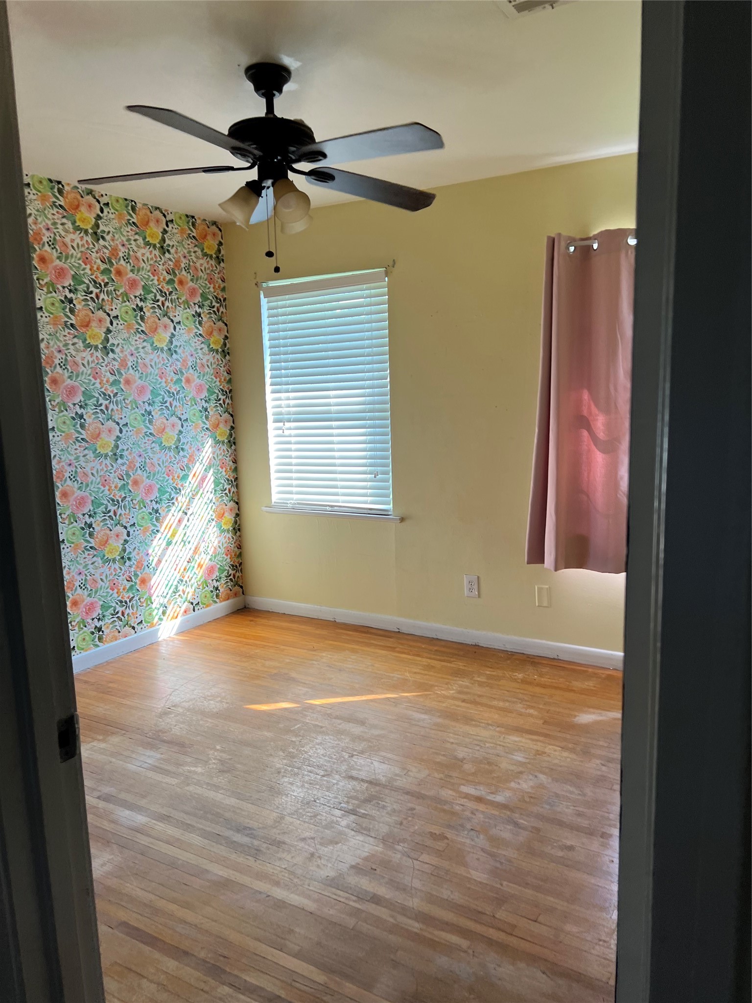 1105 Earley Street Sweeny, TX 77480 - Photo 8 of 12 a view of an empty room with a window and a ceiling fan
