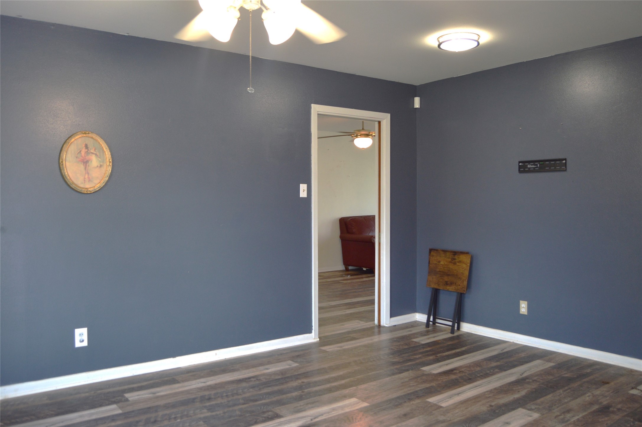 1105 Earley Street Sweeny, TX 77480 - Photo 10 of 12 a view of an empty room with wooden floor and a window