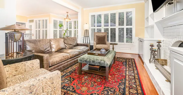 a living room with furniture and a rug