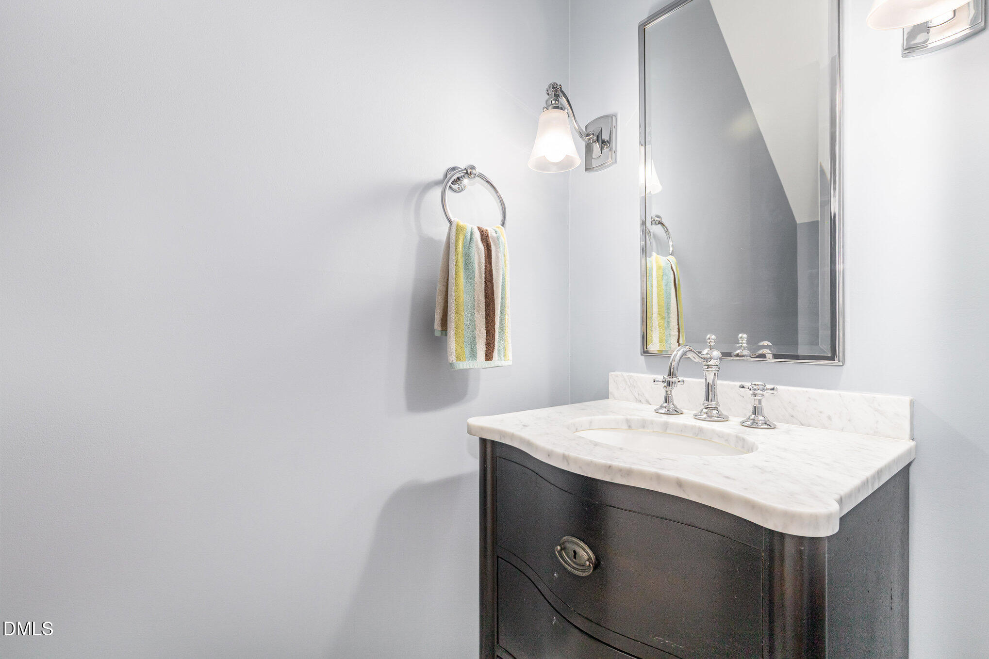 8700 Aldersgate Way Raleigh, NC 27615 - Photo 16 of 34 a bathroom with a sink and a mirror
