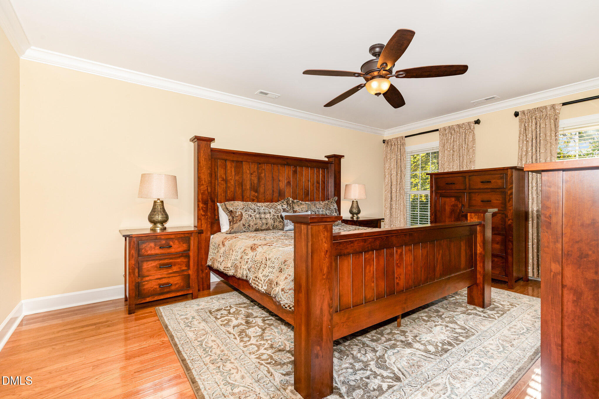 8700 Aldersgate Way Raleigh, NC 27615 - Photo 17 of 34 a bed room with a bed and a ceiling fan