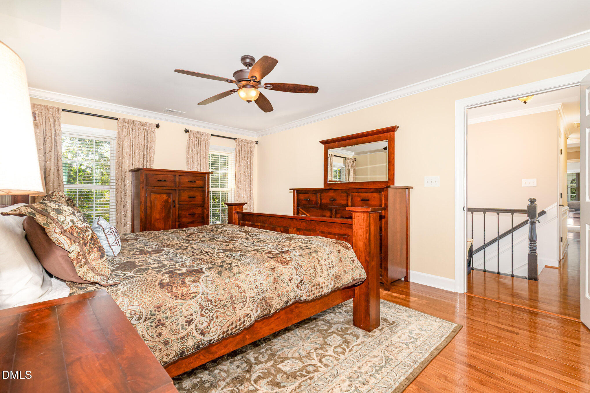 8700 Aldersgate Way Raleigh, NC 27615 - Photo 18 of 34 a bed room with a bed and a dresser