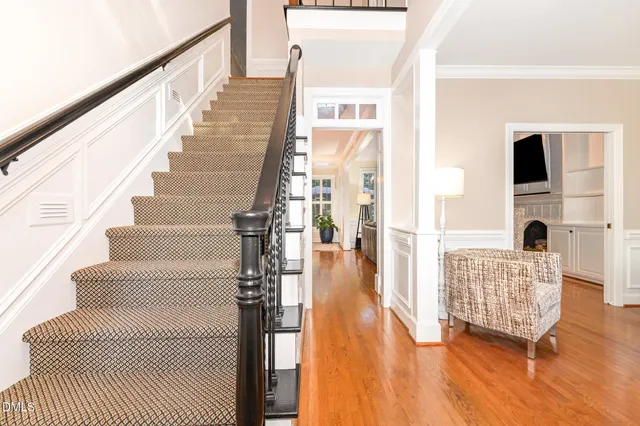 a view of an entryway with wooden floor and windows