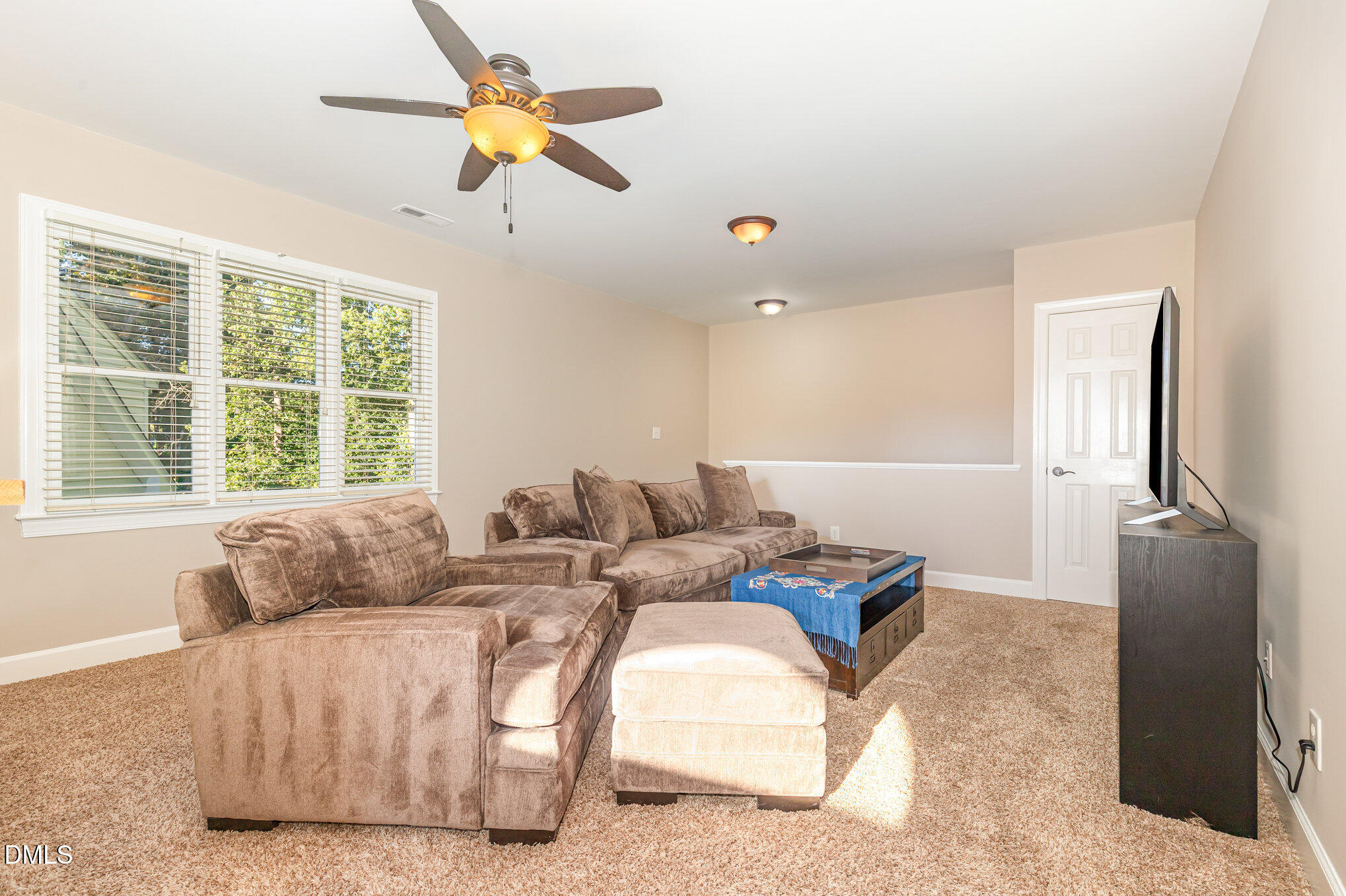 8700 Aldersgate Way Raleigh, NC 27615 - Photo 21 of 34 a living room with furniture and a window