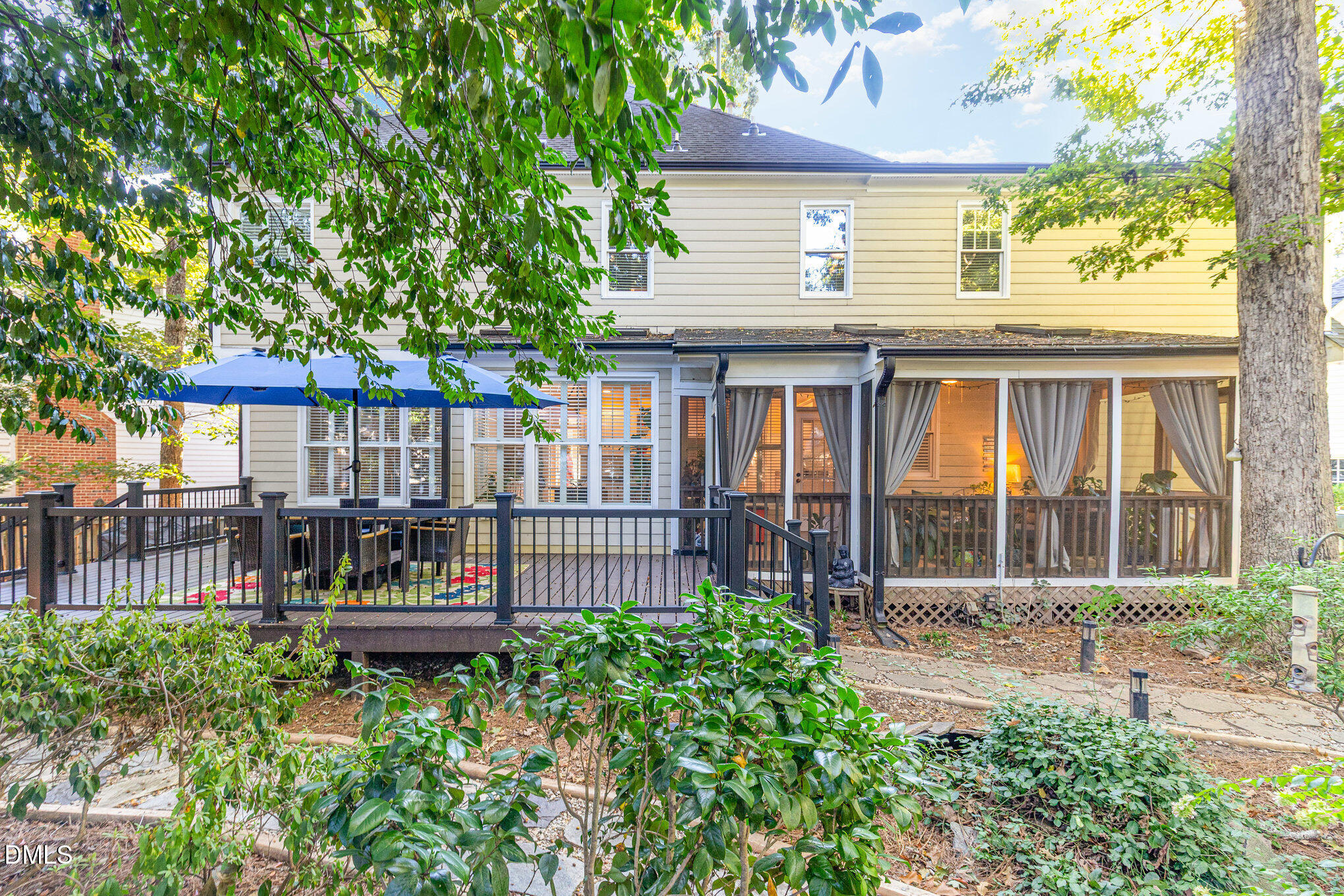 8700 Aldersgate Way Raleigh, NC 27615 - Photo 32 of 34 a front view of a house with garden and patio
