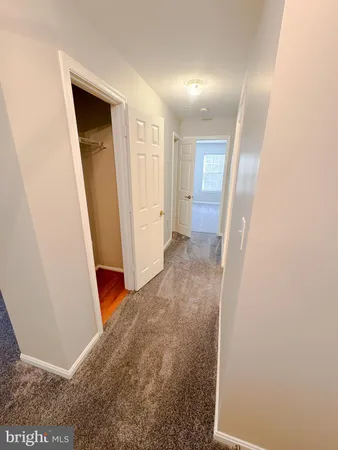 a view of a hallway with closet