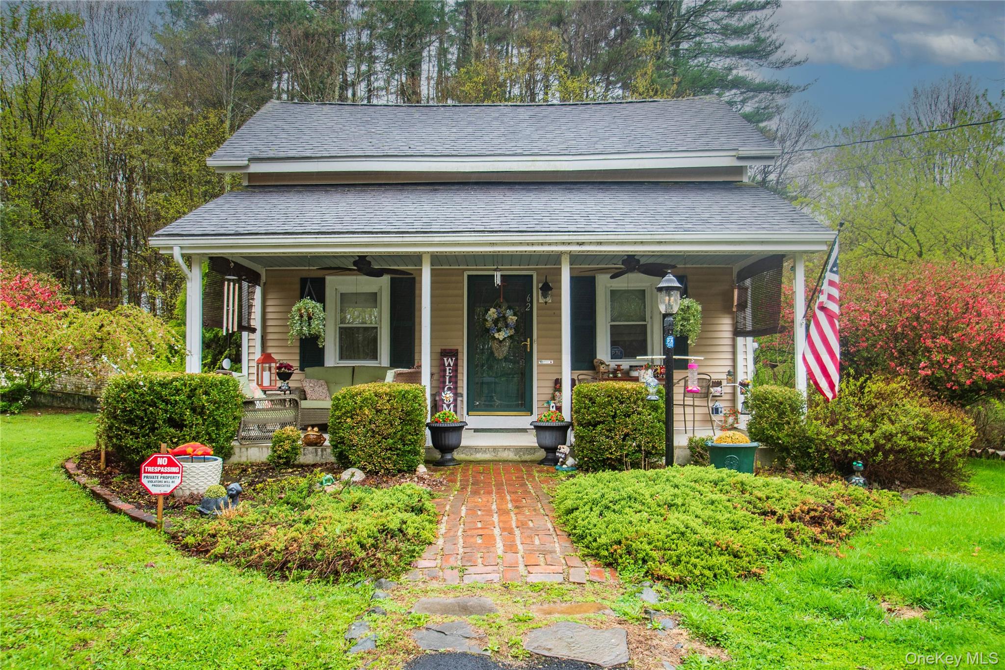 62 Thornton Road Wurtsboro, NY 12790 - Photo 1 of 30 a front view of a house with garden