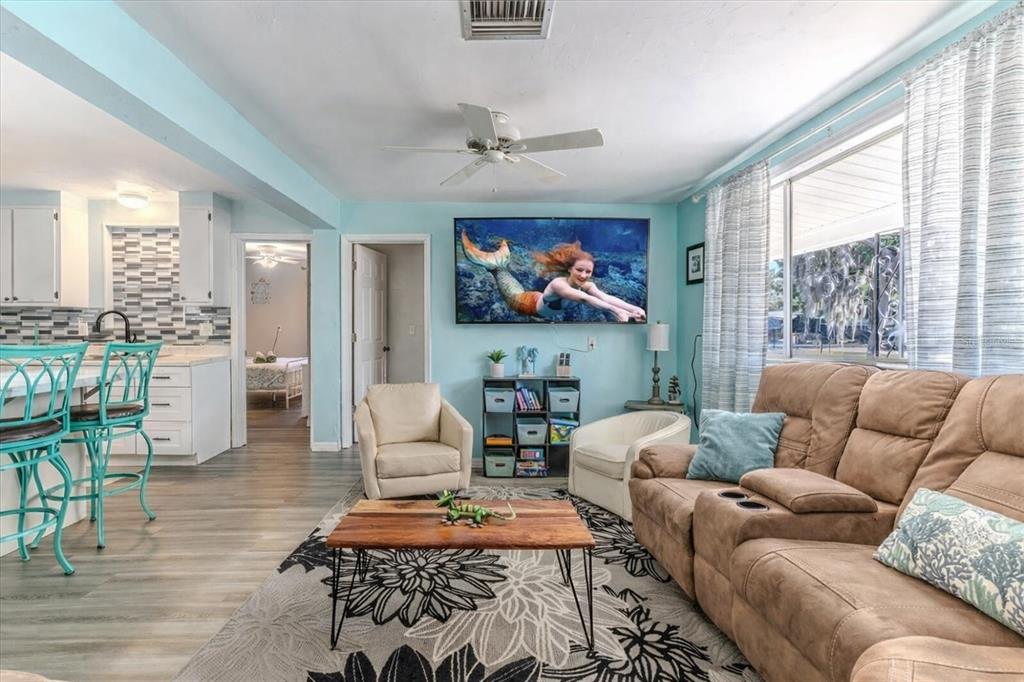 5261 Circle Drive Weeki Wachee, FL 34607 - Photo 17 of 49 a living room with furniture and a flat screen tv