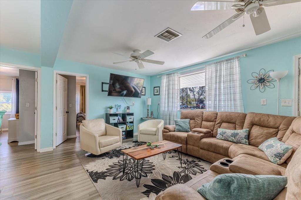 5261 Circle Drive Weeki Wachee, FL 34607 - Photo 18 of 49 a living room with furniture and a large window