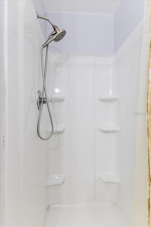 5261 Circle Drive Weeki Wachee, FL 34607 - Photo 29 of 49 a bathroom with a shower