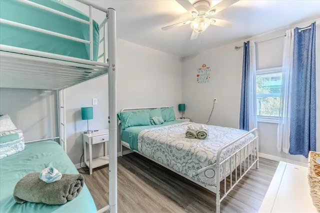 a bedroom with a bed and a view of bedroom