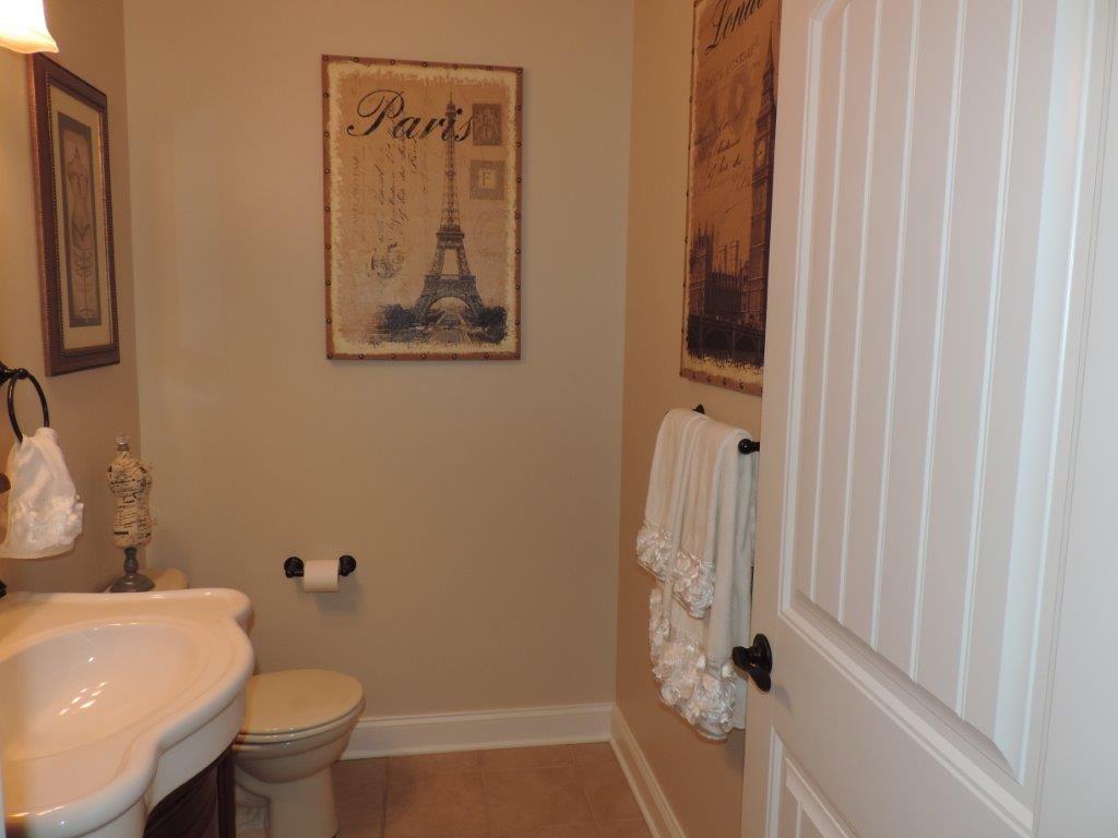 1145 Mohawk Road McDonald, PA 15057 - Photo 11 of 24 1145 Mohawk Road Powder Room - Neutral wall tone, hardwood flooring, custom sink with vanity, custom mirror, custom lighting, commode