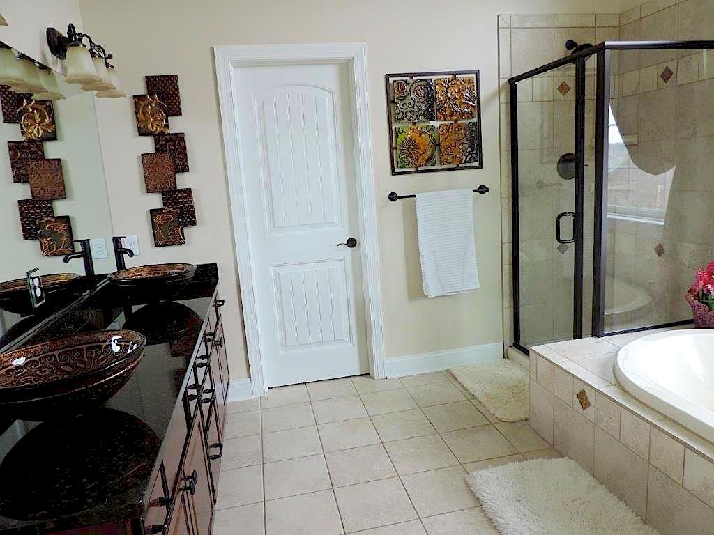 1145 Mohawk Road McDonald, PA 15057 - Photo 18 of 24 1145 Mohawk Road Resort Style Master Bath - Features an oversized ceramic shower stall, tub, & granite tops, neutral wall tone & flooring, large windows, commode